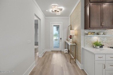 This stunning Hulbert Homes model in Veranda Bay isn't just on Ocean Palm Golf Course in Florida - for sale on GolfHomes.com, golf home, golf lot
