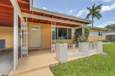 This charming 3-bedroom, 2-bathroom home offers the perfect on Fort Lauderdale Country Club in Florida - for sale on GolfHomes.com, golf home, golf lot