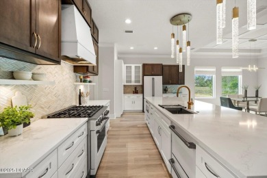 This stunning Hulbert Homes model in Veranda Bay isn't just on Ocean Palm Golf Course in Florida - for sale on GolfHomes.com, golf home, golf lot