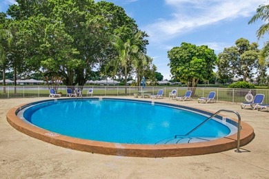 Very desirable bottom floor condo with views of the water, golf on Atlantis Golf Club in Florida - for sale on GolfHomes.com, golf home, golf lot