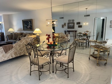 Very desirable bottom floor condo with views of the water, golf on Atlantis Golf Club in Florida - for sale on GolfHomes.com, golf home, golf lot