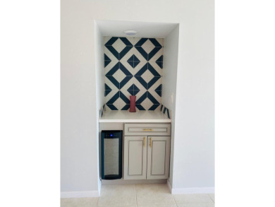 This beautifully remodeled corner unit offers serene views of on Boca Dunes Golf and Country Club in Florida - for sale on GolfHomes.com, golf home, golf lot