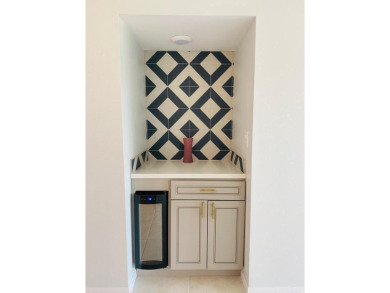 This beautifully remodeled corner unit offers serene views of on Boca Dunes Golf and Country Club in Florida - for sale on GolfHomes.com, golf home, golf lot