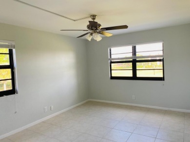 This beautifully remodeled corner unit offers serene views of on Boca Dunes Golf and Country Club in Florida - for sale on GolfHomes.com, golf home, golf lot