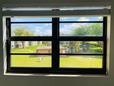 This beautifully remodeled corner unit offers serene views of on Boca Dunes Golf and Country Club in Florida - for sale on GolfHomes.com, golf home, golf lot