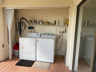 This beautifully remodeled corner unit offers serene views of on Boca Dunes Golf and Country Club in Florida - for sale on GolfHomes.com, golf home, golf lot