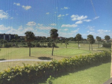 This beautifully remodeled corner unit offers serene views of on Boca Dunes Golf and Country Club in Florida - for sale on GolfHomes.com, golf home, golf lot