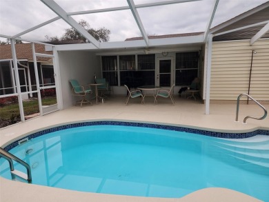 Beacon Woods East Pool Home . Huge Glass inclosed patio , Pool on Beacon Woods Golf Club in Florida - for sale on GolfHomes.com, golf home, golf lot