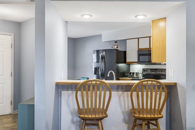 Penthouse condo with high vaulted ceilings and panoramic views on Pointe Royale Village Country Club in Missouri - for sale on GolfHomes.com, golf home, golf lot