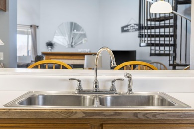 Penthouse condo with high vaulted ceilings and panoramic views on Pointe Royale Village Country Club in Missouri - for sale on GolfHomes.com, golf home, golf lot