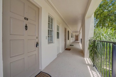 Wake up to sparkling lake views in this bright 1BR/1.5BA Palm on Palm-Aire Country Club and Resort - The Oaks in Florida - for sale on GolfHomes.com, golf home, golf lot