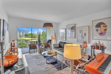 Wake up to sparkling lake views in this bright 1BR/1.5BA Palm on Palm-Aire Country Club and Resort - The Oaks in Florida - for sale on GolfHomes.com, golf home, golf lot