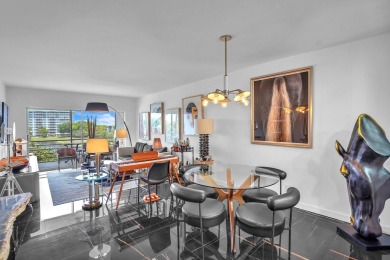 Wake up to sparkling lake views in this bright 1BR/1.5BA Palm on Palm-Aire Country Club and Resort - The Oaks in Florida - for sale on GolfHomes.com, golf home, golf lot