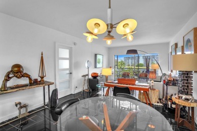 Wake up to sparkling lake views in this bright 1BR/1.5BA Palm on Palm-Aire Country Club and Resort - The Oaks in Florida - for sale on GolfHomes.com, golf home, golf lot