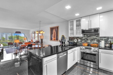 Wake up to sparkling lake views in this bright 1BR/1.5BA Palm on Palm-Aire Country Club and Resort - The Oaks in Florida - for sale on GolfHomes.com, golf home, golf lot