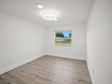 Charming 3-bedroom, 2-bathroom home nestled in the heart of Port on Port Charlotte Golf Club in Florida - for sale on GolfHomes.com, golf home, golf lot