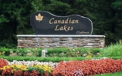 Welcome home to this brand new Andrew Ulberg Builders ranch in on Canadian Lakes Country Club-The Royal Course in Michigan - for sale on GolfHomes.com, golf home, golf lot