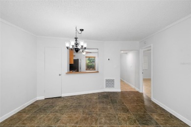 Effortless living starts here! Attractive ground-floor unit on Bayou Golf Club in Florida - for sale on GolfHomes.com, golf home, golf lot