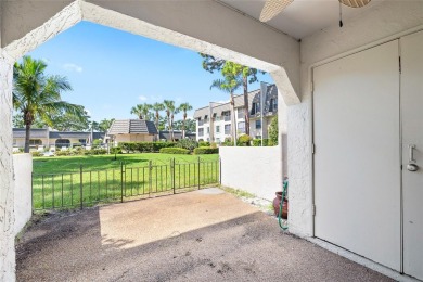 Effortless living starts here! Attractive ground-floor unit on Bayou Golf Club in Florida - for sale on GolfHomes.com, golf home, golf lot