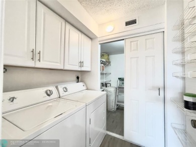 Beautifully Updated Corner Unit. Open Concept Kitchen styled in on Sunrise Lakes Phase IV Golf Course in Florida - for sale on GolfHomes.com, golf home, golf lot