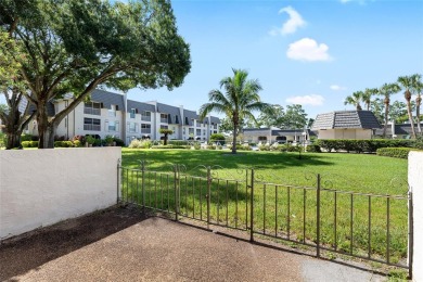 Effortless living starts here! Attractive ground-floor unit on Bayou Golf Club in Florida - for sale on GolfHomes.com, golf home, golf lot