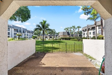 Effortless living starts here! Attractive ground-floor unit on Bayou Golf Club in Florida - for sale on GolfHomes.com, golf home, golf lot