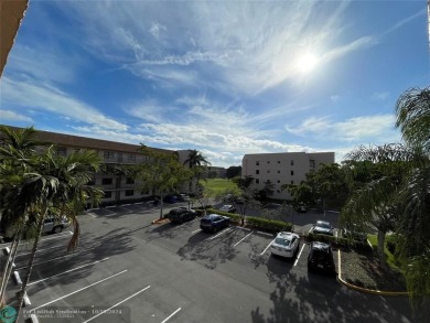 Beautifully Updated Corner Unit. Open Concept Kitchen styled in on Sunrise Lakes Phase IV Golf Course in Florida - for sale on GolfHomes.com, golf home, golf lot