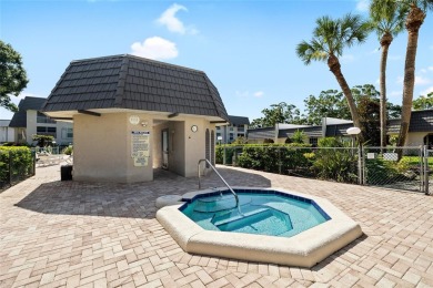 Effortless living starts here! Attractive ground-floor unit on Bayou Golf Club in Florida - for sale on GolfHomes.com, golf home, golf lot