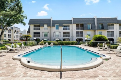Effortless living starts here! Attractive ground-floor unit on Bayou Golf Club in Florida - for sale on GolfHomes.com, golf home, golf lot