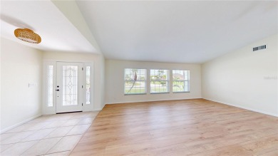 Welcome to this beautifully updated 3-bedroom, 2-bath pool home on Twin Isles Country Club in Florida - for sale on GolfHomes.com, golf home, golf lot