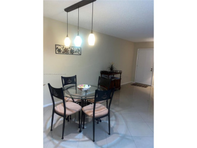 1 BEDROOM,1.1/5 BATHROOM,TILE FLOOR THROUGH OUT, NEW A/C on Wynmoor Golf Course in Florida - for sale on GolfHomes.com, golf home, golf lot