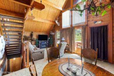 This charming Cedar log cabin is located on a scenic corner lot on Star Valley RV Golf Course in Wyoming - for sale on GolfHomes.com, golf home, golf lot