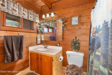 This charming Cedar log cabin is located on a scenic corner lot on Star Valley RV Golf Course in Wyoming - for sale on GolfHomes.com, golf home, golf lot