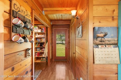 This charming Cedar log cabin is located on a scenic corner lot on Star Valley RV Golf Course in Wyoming - for sale on GolfHomes.com, golf home, golf lot