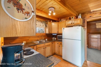 This charming Cedar log cabin is located on a scenic corner lot on Star Valley RV Golf Course in Wyoming - for sale on GolfHomes.com, golf home, golf lot