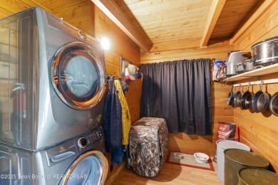 This charming Cedar log cabin is located on a scenic corner lot on Star Valley RV Golf Course in Wyoming - for sale on GolfHomes.com, golf home, golf lot