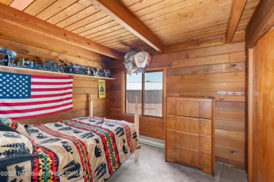 This charming Cedar log cabin is located on a scenic corner lot on Star Valley RV Golf Course in Wyoming - for sale on GolfHomes.com, golf home, golf lot