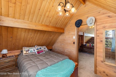 This charming Cedar log cabin is located on a scenic corner lot on Star Valley RV Golf Course in Wyoming - for sale on GolfHomes.com, golf home, golf lot