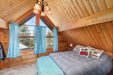 This charming Cedar log cabin is located on a scenic corner lot on Star Valley RV Golf Course in Wyoming - for sale on GolfHomes.com, golf home, golf lot