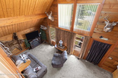 This charming Cedar log cabin is located on a scenic corner lot on Star Valley RV Golf Course in Wyoming - for sale on GolfHomes.com, golf home, golf lot