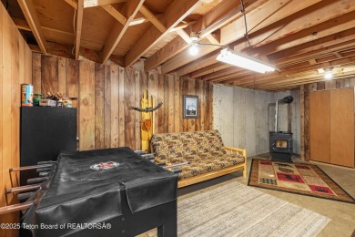 This charming Cedar log cabin is located on a scenic corner lot on Star Valley RV Golf Course in Wyoming - for sale on GolfHomes.com, golf home, golf lot