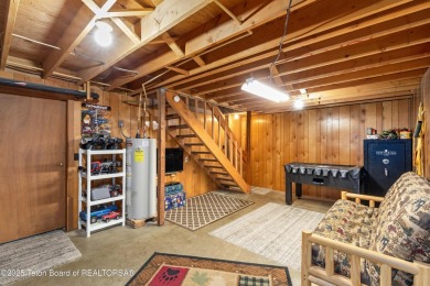 This charming Cedar log cabin is located on a scenic corner lot on Star Valley RV Golf Course in Wyoming - for sale on GolfHomes.com, golf home, golf lot