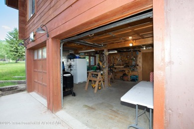 This charming Cedar log cabin is located on a scenic corner lot on Star Valley RV Golf Course in Wyoming - for sale on GolfHomes.com, golf home, golf lot