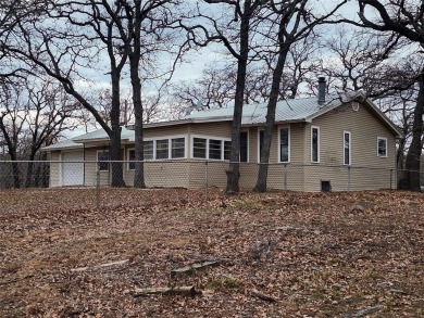 INVESTMENT!!INVESTMENT!! This home has Great bones and is ready on Nocona Hills Golf Course in Texas - for sale on GolfHomes.com, golf home, golf lot