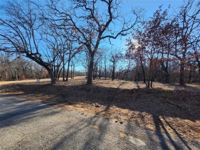 Beautiful corner lot build site with lake views and mature oak on Nocona Hills Golf Course in Texas - for sale on GolfHomes.com, golf home, golf lot