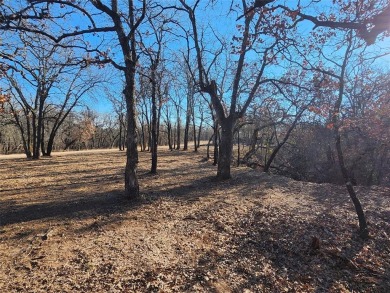 Beautiful corner lot build site with lake views and mature oak on Nocona Hills Golf Course in Texas - for sale on GolfHomes.com, golf home, golf lot