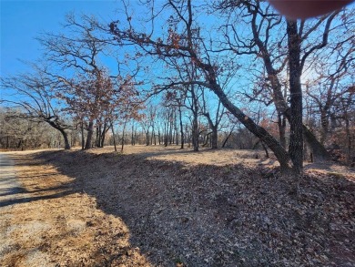 Beautiful corner lot build site with lake views and mature oak on Nocona Hills Golf Course in Texas - for sale on GolfHomes.com, golf home, golf lot