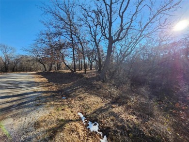 Beautiful corner lot build site with lake views and mature oak on Nocona Hills Golf Course in Texas - for sale on GolfHomes.com, golf home, golf lot