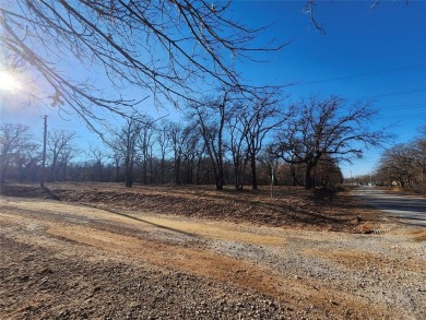 Beautiful corner lot build site with lake views and mature oak on Nocona Hills Golf Course in Texas - for sale on GolfHomes.com, golf home, golf lot