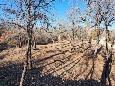 Beautiful corner lot build site with lake views and mature oak on Nocona Hills Golf Course in Texas - for sale on GolfHomes.com, golf home, golf lot